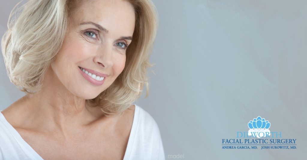 woman (model) considering eyelid surgery