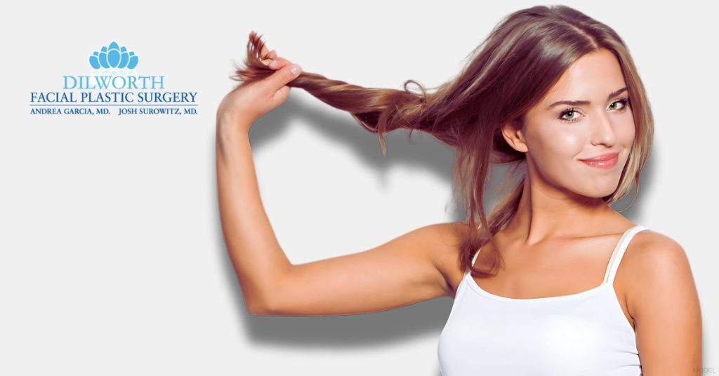 Woman in a white tank top is holding their hair up (model) Dilworth Facial Plastic Surgery Logo