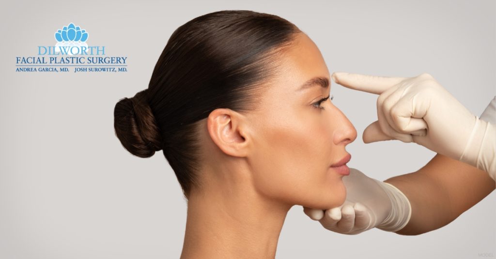 A woman being examined by a plastic surgeon (model) Dilworth Facial Plastic Surgery Logo