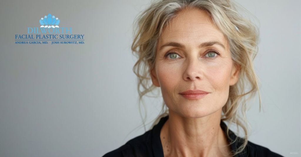 Woman considering facial plastic surgery. (Model)