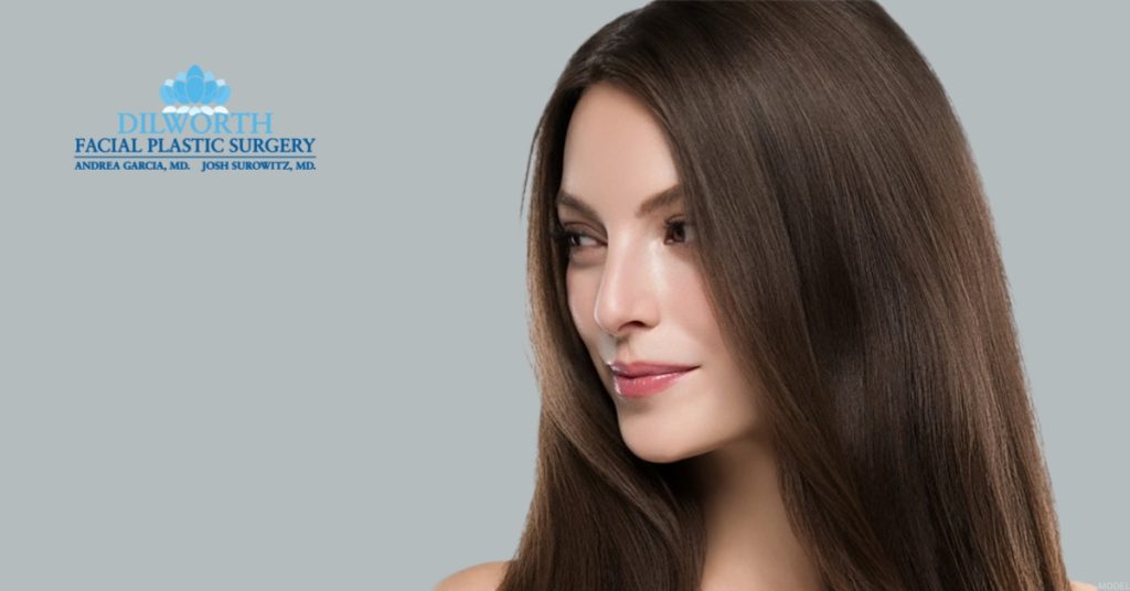 Woman representing a patient considering rhinoplasty for a deviated septum, with the Dilworth Facial Plastic Surgery logo. (Model)